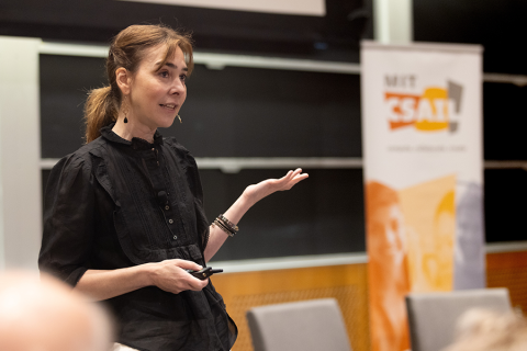 MIT professor Dina Katabi giving a presentation in an auditorium in the Stata Center (Credit: Mike Grimmett).