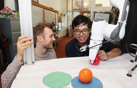 The “Diffusion Forcing” method can sort through noisy data and reliably predict the next steps in a task, helping a robot complete manipulation tasks, for example. In one experiment, it helped a robotic arm rearrange toy fruits into target spots on circular mats despite starting from random positions and visual distractions (Credits: Mike Grimmett/MIT CSAIL).